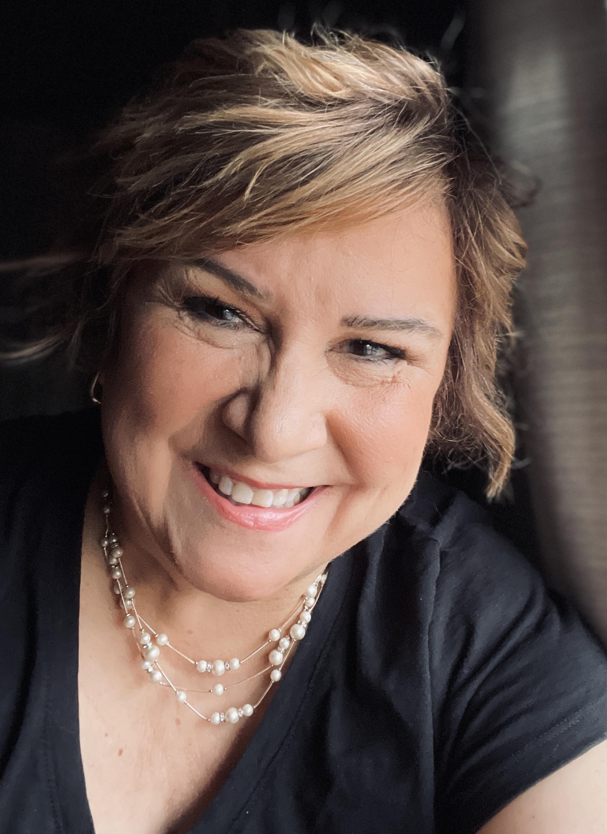 Krista Doyle, grandmother and founder of PrayersToText.com